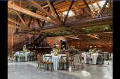 an image of a wedding venue with tables and chairs set up for the guests to eat