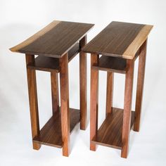 two wooden tables sitting next to each other