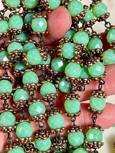 8mm, Faceted Czech Celadon Green Beads. Bumby Copper Bead Caps and Black Wire. Bead Chain. Priced By the Foot. Limited Quantity.   Handcrafted By Us In Corrales, New Mexico. Adjustable Beaded Necklaces With Bead Caps, Green Beads With Bead Caps For Jewelry Making, Corrales New Mexico, Celadon Green, Gothic Accessories, Green Beads, Bead Chain, Bead Caps, Green Bead