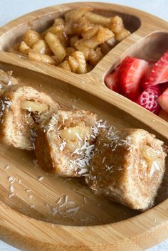 some food is sitting on a wooden tray