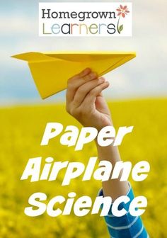 a hand holding a yellow paper airplane in front of a field with the words paper airplane games