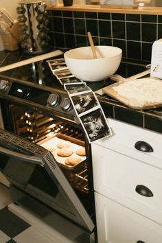 an oven with doughnuts in it and baking utensils on the counter