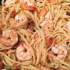 pasta with shrimp and tomatoes in a skillet