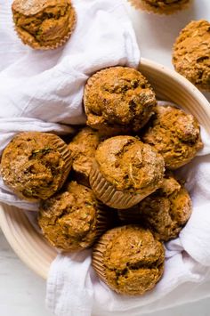 some muffins are sitting in a bowl on a table