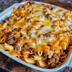 a casserole dish with cheese and ground beef