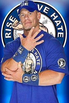 a man with his arms crossed in front of a blue and white sign that says rise we hate