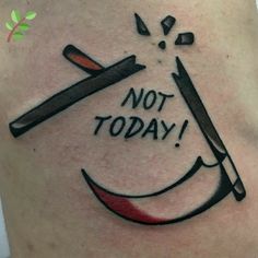 a tattoo that says not today on the side of a woman's thigh with two knives