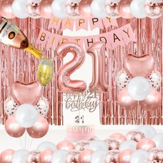 a pink and white 21st birthday party with balloons, confetti and champagne bottles