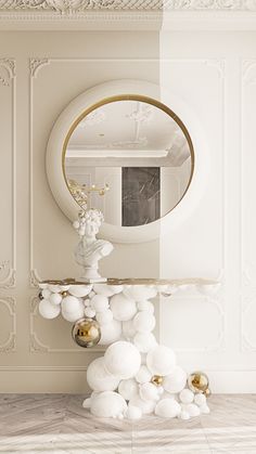 a white table topped with balloons and a mirror in a room next to a wall