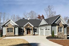 a large house with two car garages on the front and one story above it