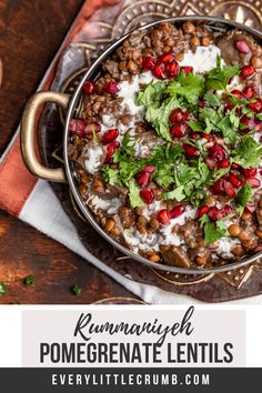 a bowl filled with pomegranate lentils and garnished with cilantro