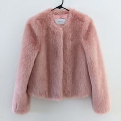 This Stand Sofia Cropped Faux Fur Jacket In Soft Pink Is A Stand Out Piece, Perfect To Wear With Dresses/Skirts, Or Add A Little Fun To Jeans And A T-Shirt. Cut For A Cute Cropped Fit And Featuring Two Side Pockets, A Hook And Eye Fastening And A Round Collar For Timeless Elegance, This Jacket Layers Up Casual Looks Or Adds Stylish Warmth To Evening Looks. - Faux Fur Outer - Hook And Eye Fastening - Two Side Pocket - One Internal Zippered Pocket - Fully Lined Size 34 (Us 4/Small) Spring Faux Fur Workwear Coat, Spring Workwear Faux Fur Coat, Spring Faux Fur Lined Outerwear For Work, Spring Workwear Fur Coat With Faux Fur Lining, Spring Workwear Outerwear With Faux Fur Lining, Pink Fur Jacket, Pink Faux Fur Coat, Pink Fur Coat, Faux Fur Cropped Jacket