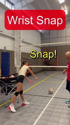 two people are playing volleyball in an indoor court with the words wrist snap on it