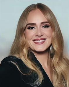 a woman with long blonde hair smiling at the camera and wearing a black top,