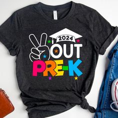 a t - shirt that says out prek on it with a graduation cap and peace sign