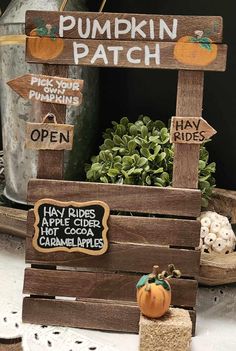 wooden pumpkin patch sign sitting on top of a table