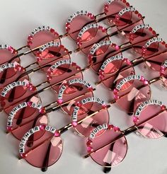 pink heart shaped sunglasses with the word brides written on them and crystal hearts in front of them