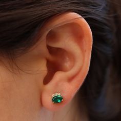 Dress up with these sophisticated pair of emerald earrings full of sparkle and chic`They look so perfectly beautiful they are an instant classic.Make a beautiful statement wherever you go!- Made to Order, perfectly finished, Fast shipping fully insured and trackable online.- Emerald information: Two 6x4mm oval cut Chatham Emeralds 1.02 ctw- Diamond information: 2X 1.5 mm, 4X 1.25 mm Diamonds, VS-E, 0.08 ctw- Arrives gift ready with a certificate of authenticity. Green Stud Earrings, Emerald Earring, Sapphire Earrings Studs, Emerald Earrings Studs, Sapphire Studs, May Birthstone, Gold Stud Earrings, Ruby Earrings, Emerald Earrings