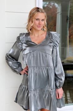 Model is 5'6" wearing a size Small. Fabric Contents: 60% Rayon, 40% Polyester No stretch Gunmetal color Brand: Umgee Chic Metallic Dress For Fall, Metallic Fitted Dress With Ruffles, Spring Metallic Dress With Ruffles, Athleisure Dress, Ruffle Long Sleeve, Tiered Dress, Sweater Skirt, Short Tops, Jacket Dress