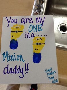 a sign that says you are my one in a minion daddy with two hands