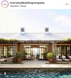 an outdoor living area next to a swimming pool