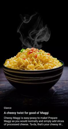 a bowl filled with noodles and vegetables on top of a wooden table next to a black background