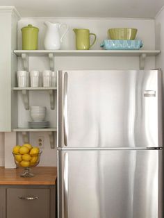 a white refrigerator freezer sitting inside of a kitchen