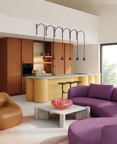 a living room filled with furniture next to a kitchen and an open floor plan on the wall