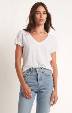 Made using our lightweight jersey fabric that has that worn-in feel you love, this easy-to-wear tee sits right below the waist to be worn tucked or untucked. Denim Sweater Jacket, Denim Sweater, Ladies Boutique, V Neck Tee, Sweater Jacket, Jersey Fabric, Knit Jersey, Jumpsuit Dress, V Neck T Shirt