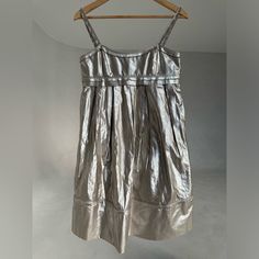 Omg This Is So Cute. Slip In Skirt. Babydoll Style. Silver Metallic Finish. Cute Cute Cute. Only Worn For 1 Event. Summer Festive A-line Dress, Metallic Summer Cocktail Dress, Spring Metallic Sleeveless Midi Dress, Metallic Sleeveless Midi Dress For Spring, Sleeveless Metallic Midi Dress For Spring, Metallic Mini Dress For Summer Formal Events, Metallic Mini Dress For Formal Summer Events, Metallic Silk Dresses, Silk Summer Festive Dress