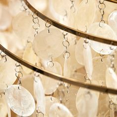 several circular glass beads hanging from a ceiling