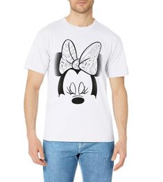 a man wearing a mickey mouse t - shirt with a bow on it's head