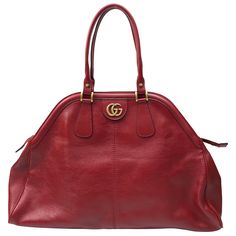 Gucci Red Marmont Re(Belle) Handbag. This beautiful Gucci handbag is in excellent condition. It has no sign of use and has the care card with a color swatch in the pocket. It is a large bag with a deep red leather material. There is gold hardware with a gold "GG" on one side and a gold Tiger head on the other side. It has a gold zipper going across the top with two top handles. This piece is the perfect addition to any summer outfit and has plenty of room on the inside for storage of items. Meas Gucci Formal Handheld Shoulder Bag, Chic Gucci Satchel With Removable Pouch, Gucci Handheld Shoulder Bag For Formal Occasions, Formal Gucci Handheld Shoulder Bag, Gucci Satchel With Handle Drop For Shopping, Everyday Handheld Gucci Satchel, Gucci Formal Satchel With Removable Pouch, Gucci Satchel With Removable Pouch For Formal Occasions, Chic Gucci Satchel For Shopping