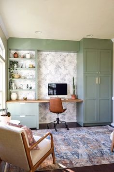 a living room filled with furniture and a flat screen tv on top of a wooden desk