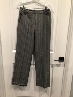 NWOT Dressbarn women’s size 4 dress pants Gray light blue white pinstripes Hook and eye and zipper in front 65% polyester 32% viscos Has belt loops  2 pockets in front 2 pockets in back  Measurements 30 inches waist  40 inches length 31 inches inseam  Hem on right leg needs to be restitched Excellent condition  A61 Tailored Striped Pants With Pockets, Fitted Striped Pants For Office, Fitted Striped Straight Leg Dress Pants, Fitted Pinstripe Office Bottoms, Pinstripe Fitted Office Bottoms, Fitted Pinstripe Bottoms For Office, Formal Striped Bottoms With Belt Loops, Pinstripe Fitted Bottoms For Office, Pinstripe Bottoms With Pockets For Formal Occasions