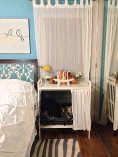 a bedroom with a dog in its cage