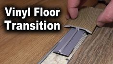 a person is working on a wood floor with the words vinyl floor transition