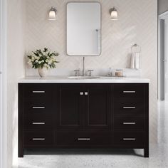 a bathroom vanity with two sinks and a large mirror above it, in front of a doorway