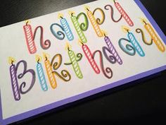 a birthday card with candles and the words happy birthday written in multicolored letters