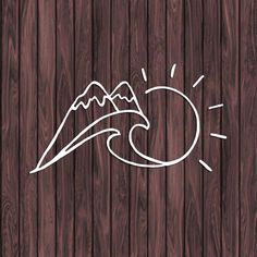 a wooden background with mountains and waves drawn on the wood grained surface in white