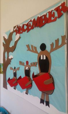 a bulletin board with reindeers and trees on it