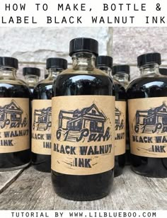 six bottles of black walnut ink sitting on top of a wooden table with the words how to make, bottle & label black walnut ink