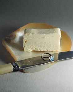 a piece of cake sitting on top of a plate next to a knife