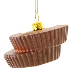 two pieces of chocolate hanging from a gold chain