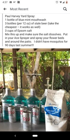 several bottles of water sitting on top of a table next to a bag of flour