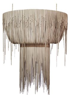 a chandelier made out of sticks with icicles hanging from the top and bottom