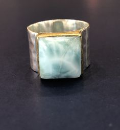 Such a beautiful green and white mixture stone in this ring, appears to be a larimar stone.  Thick beautiful hammered silver stamped 925.  Size 8 JK Estate Unique Silver Larimar Rings, Unique Larimar Jewelry For Anniversary, Anniversary Larimar Jewelry Stamped 925, Colored Stone Rings, Larimar Stone, China Tea Cups, Color Stone, Hammered Silver, Flower Ring