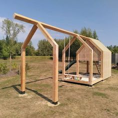 a wooden structure with a slide in it