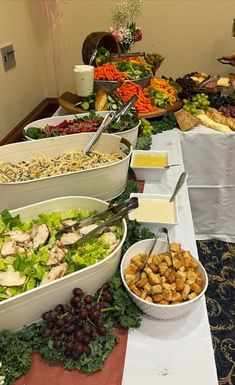 a buffet table filled with different types of food