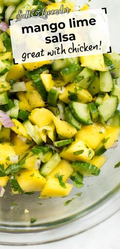 mango lime salsa in a glass bowl with a sign that says,'salsa time great with chicken '